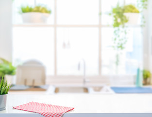 Wood table top on blurred kitchen background