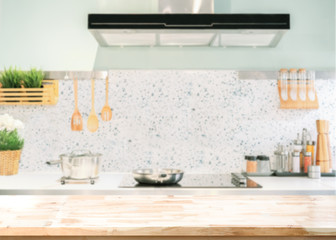Wood table top on blurred kitchen background