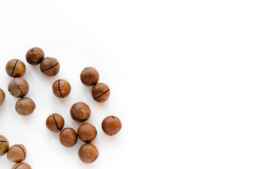 Macadamia nuts in the shell isolated on a white background close-up.