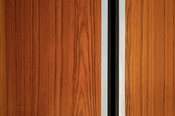 Old soviet elevator's doors. Wooden texture