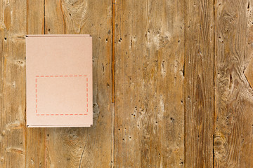 Cardboard box on wooden background