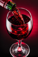 glass of red  wine and bottle
