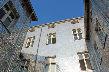 Building with mirrored walls. Facade of building made of mirror fragments