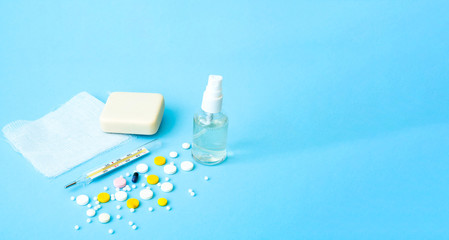 Medical hand sanitizer gel and soap for hand hygiene coronavirus protection on blue background. Coronavirus prevention.Close-up