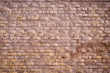 Old red brick wall background. Side illuminated beautiful textured wall