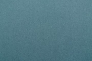 blue or turquoise fabric background with copy space for text or image. Pattern, texture, background. 