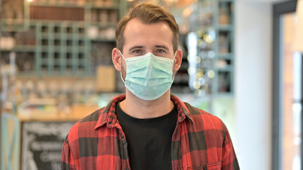Portrait of Beard Young Man with Protective Face Mask