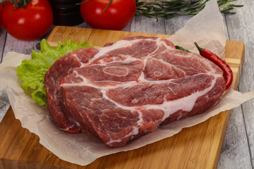 Raw pork neck steak
