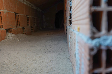 Eco-friendly cellulose insulation for attic. House heat preservation and energy saving