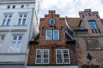 Lubeck, Germany, 10-06-2019 historic buildings with gothic brick facades in the old town