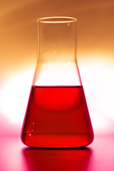 Retort with red chemical reagent