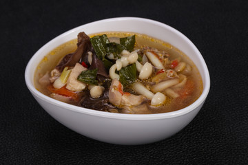 Thai style soup with meat and mushrooms