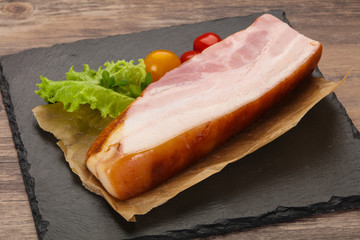 Smoked pork breast with salad leaves