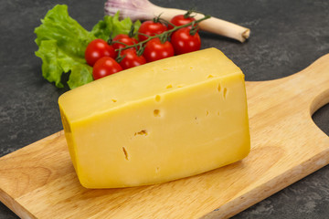 Hard yellow tasty cheese brick