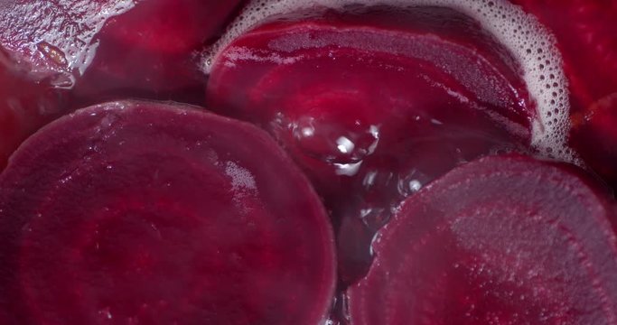 Fresh beets are boiled in the pot.