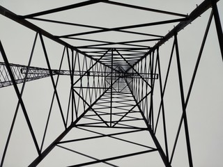 Inside electrical tower on gray sky background