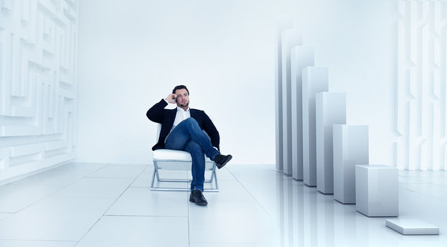 Businessman talking on mobile phone and Augmented reality (AR) financial charts showing falling revenue and stock market fall and crisis . Modern technology concept. - Powered by Adobe