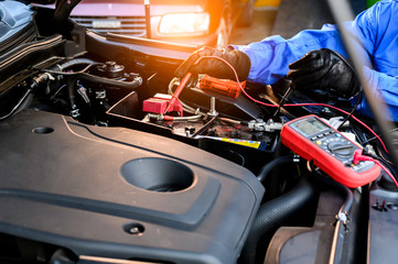 technicians working on auto mechanics for car repair and maintenance work, car repair workers with...
