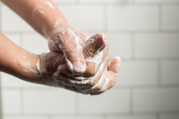 A man washing hands with soap. Preventing spreading virus concept.