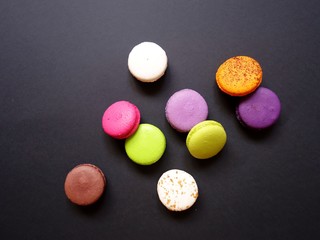 layout of colored macaroons on a solid color background