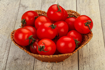 Ripe juicy cherry tomato in the bowl