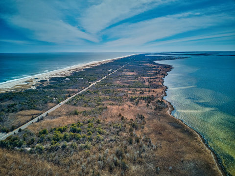 Aerial Drone image looking south towards the Barnegat Inlet at New Jersey Island Beach State Park between the Atlantic Ocean and Barnegat Bay