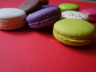 layout of colored macaroons on a solid color background