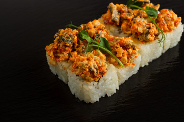 Japanese food: Set of salmon sushi and rolls with salmon and eel