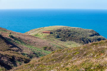 Fototapeta na wymiar Seascape in early spring. Rocky steep seashore. Sea nature landscape. View of the sea from mountain.