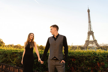 France, Paris, Eiffel tower. Couple in love. Romantic date, marriage proposal, honeymoon, travel. Valentines day