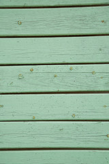 old green painted boards with nails