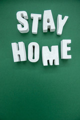 Stay Home appeal volumetric concrete Letters isolated on a plain one color Background