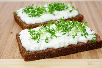 Wholemeal bread sandwiches with cress and white cheese