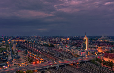 View over Munich at rush hour at the Donnersberger bridge with lights of cars in high angle view.