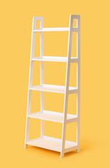 Empty shelving unit on color background
