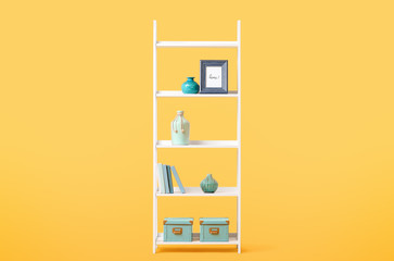 Shelving unit with decor on color background