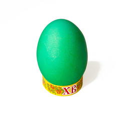 Brightly colored green easter egg isolated on white background