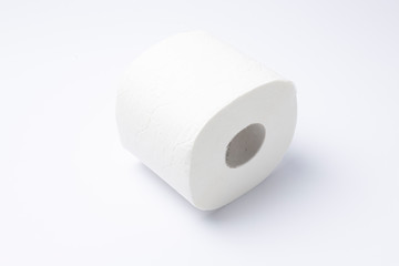 Symbol image for corona crisis panic buying / hoarding. Roll of toilet paper on white Background, with copy space.