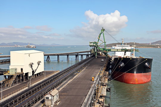 Cargo terminal for loading coal cargos by shore cranes. Port Gladstone, Australia. December, 2019.