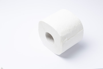 Symbol image for corona crisis panic buying / hoarding. Roll of toilet paper on white Background,...