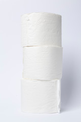 Symbol image for corona crisis panic buying / hoarding. Pile of toilet paper on white Background, with copy space.