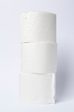 Symbol image for corona crisis panic buying / hoarding. Pile of toilet paper on white Background, with copy space.