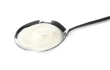 Spoon with tasty cream cheese on white background