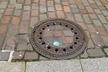 Iron manhole cover for the drainage of the road