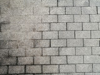 grey granite tiles are laid on the streets of the city