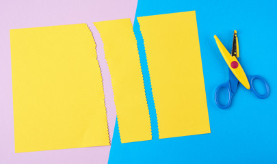  plastic scissors and yellow stripes with a zigzag end