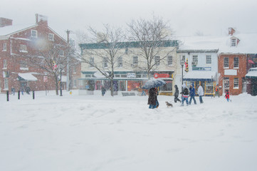 Annapolis street scene of shops during blizzard with snow falling heavily