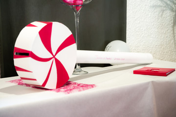 gift box with red ribbon and bow on wooden table