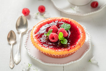 Enjoy your raspberry cheesecake with red jelly