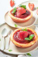 Fresh and sweet strawbery cheesecake with red jelly